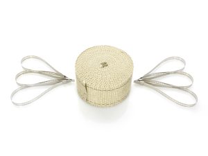 Retractable cable worry lock with silver loops for motorcycle security.