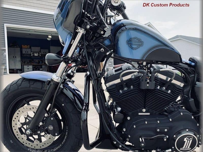 Harley Davidson motorcycle with custom black and blue paint, chrome details, and powerful engine.