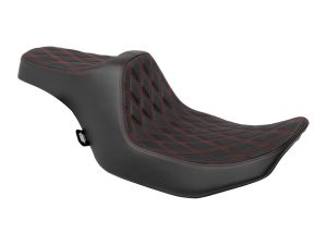 Vintage motorcycle seat with black leather and red stitching for custom Harley Davidson bikes.