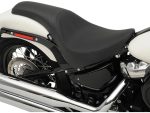 Sleek black motorcycle seat with chrome exhaust pipe - perfect for Harley Davidson enthusiasts.