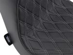 Luxury black motorcycle seat with diamond stitch quilting for comfort and style.