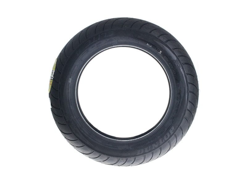 Dunlop motorcycle tire for Revelry Motorcycles, high-performance road tyre, durable, tyre tread pattern, black rubber, tyre sidewall.