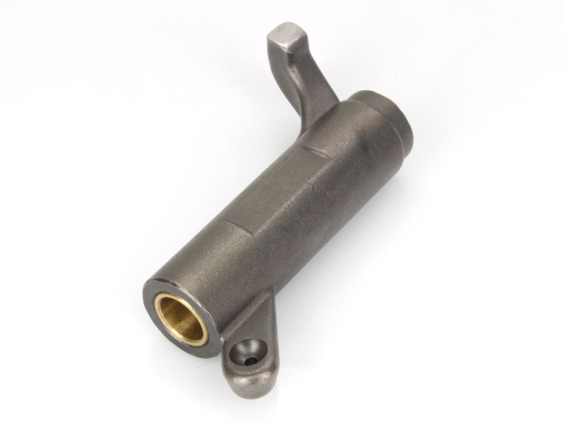 Aluminium motorcycle engine component with brass bushing.