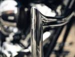 Shiny chrome Revelry Motorcycles fork close-up, showcasing high-quality craftsmanship.