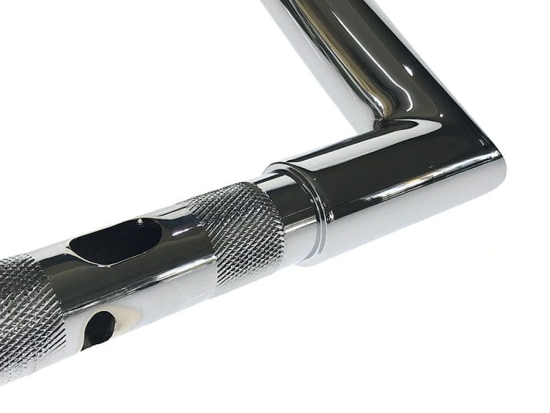 Precision motorcycle handlebar with textured grips and polished chrome finish.