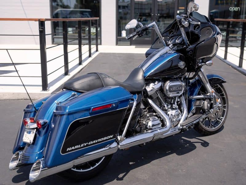 Blue Harley-Davidson touring motorcycle with saddlebags and chrome accents for motorcycle enthusiasts.