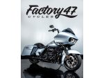 Black Harley-Davidson touring motorcycle with sleek silver finish and custom features.
