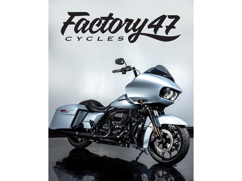 Black Harley-Davidson touring motorcycle with sleek silver finish and custom features.