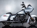 Sleek silver leather cruiser motorcycle with custom touring fairing and black accents.