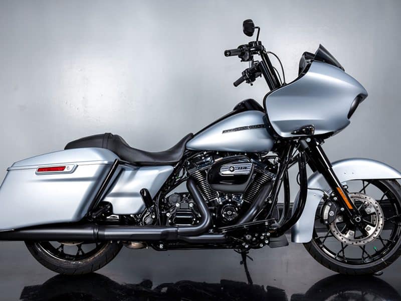 Sleek silver leather cruiser motorcycle with custom touring fairing and black accents.