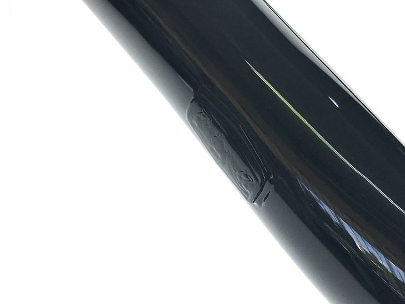 Black motorcycle frame close-up image for Revelry Motorcycles SEO.