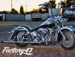 Classic Harley-Davidson cruiser motorcycle with chrome finish at Revelry Motorcycles Australia.