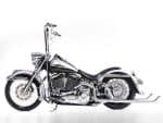Shiny chrome cruiser motorcycle featuring classic Harley-Davidson design. Perfect for motorcycle enthusiasts and custom bike lovers.