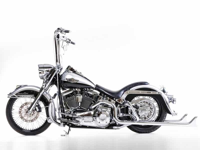 Shiny chrome cruiser motorcycle featuring classic Harley-Davidson design. Perfect for motorcycle enthusiasts and custom bike lovers.