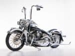 VINTAGE Harley-Davidson motorcycle with chrome details and black accents, perfect for motorcycle enthusiasts.