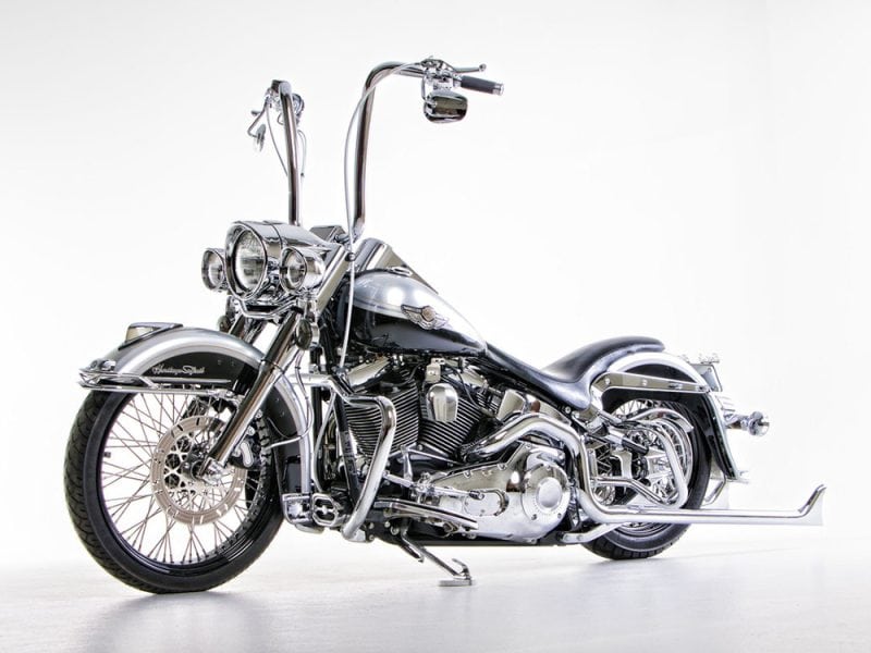 VINTAGE Harley-Davidson motorcycle with chrome details and black accents, perfect for motorcycle enthusiasts.