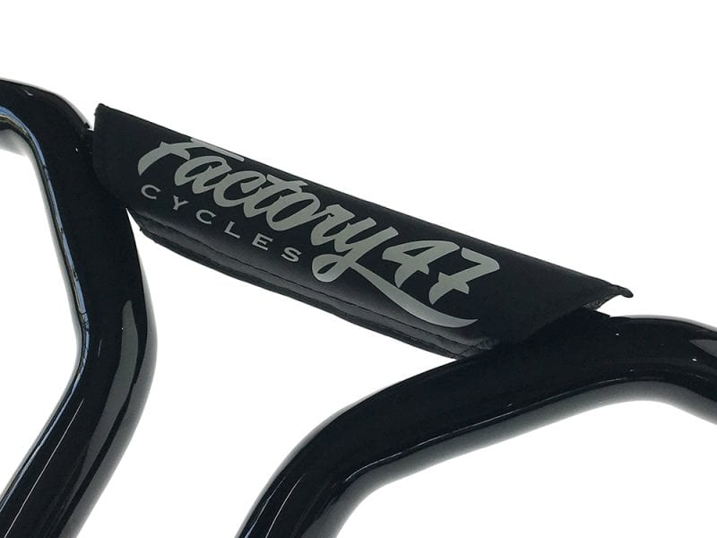 Tacy43 Cycles handlebar with black padding and logo detail for custom motorcycles and bike accessories.