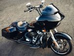 Black touring motorcycle with custom fairing and chrome engine details.