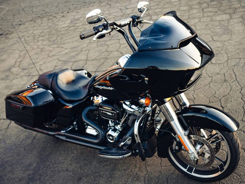 Black touring motorcycle with custom fairing and chrome engine details.