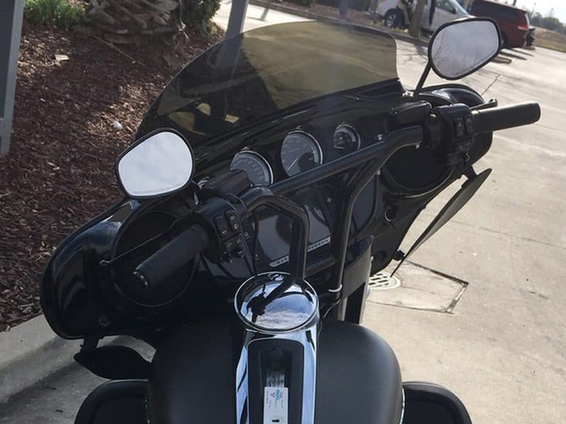 Motorcycle dashboard with black body and modern gauges at Revelry Motorcycles, Australia.