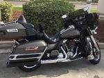 Harley-Davidson touring motorcycle with saddlebags and comfort features, ideal for long rides.