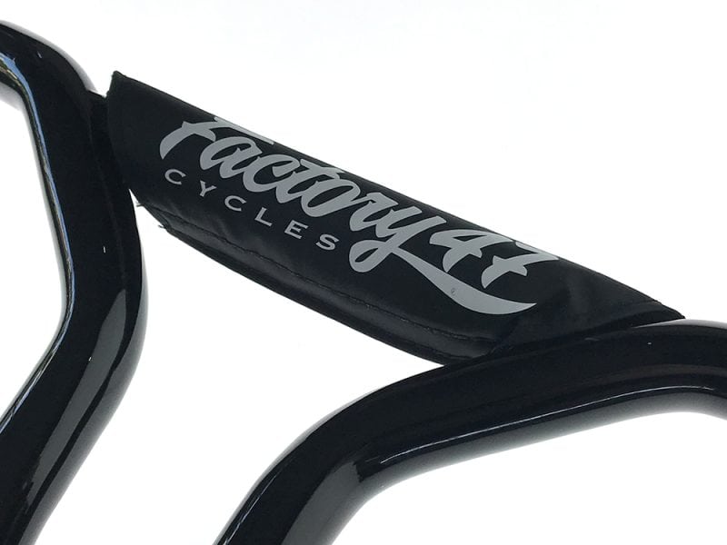 Revelry Cycles motorcycle seat with logo branding and black upholstery, showcasing quality craftsmanship.