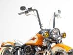 Vibrant orange and cream Harley Davidson motorcycle with chrome accents for sale at Revelry Cycles.