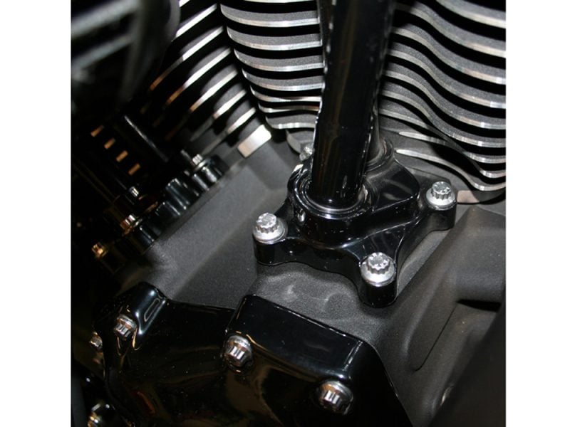 Engine close-up shot with black and chrome details, highlighting motorcycle engine components at Revelry Cycles.
