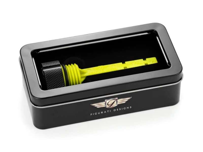 Bright yellow motorcycle tire lever inside black Revelry Designs branded storage box for motorcycle maintenance.