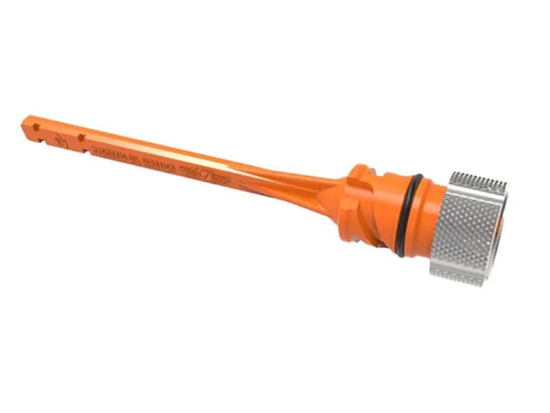 High visibility orange chain breaker tool for motorcycle maintenance and repair.