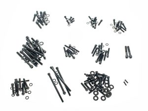 Assorted black motorcycle bolts and washers for custom bike builds and repairs.