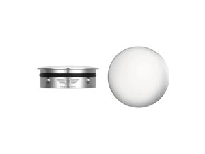 Chrome motorcycle headlight with sleek design and advanced illumination for Revelry Motorcycles.