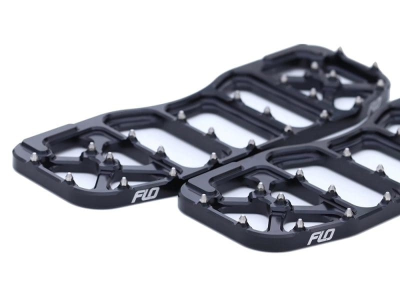 Aluminium bike pedals with metal studs for enhanced grip, suitable for adventure and mountain biking.