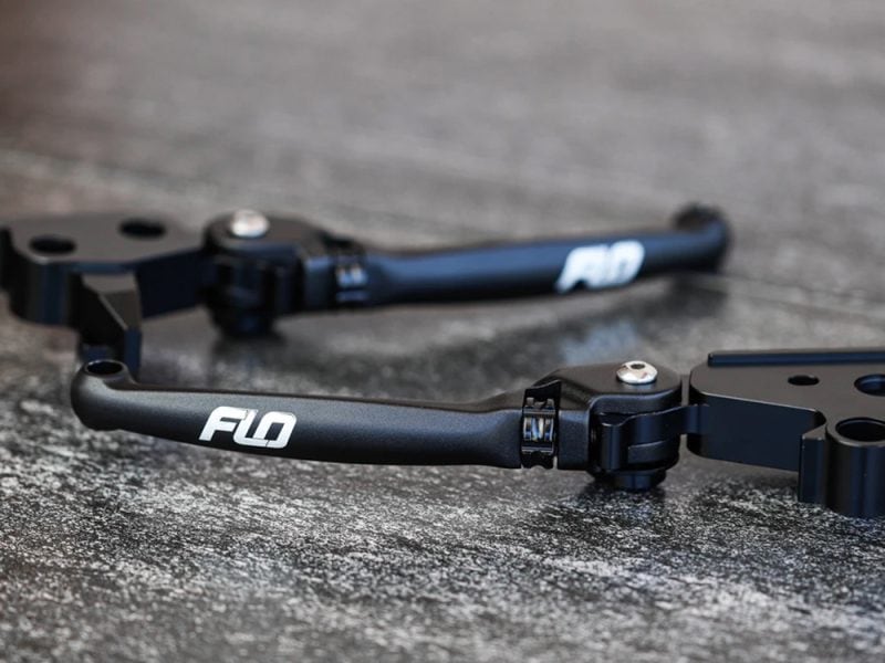 High-quality motorcycle handlebar with Flo branding for enhanced riding performance.
