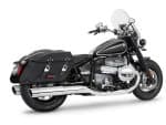 BMW cruiser motorcycle with black leather saddlebags, chrome accents, and a comfortable touring design.