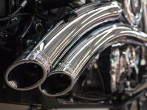 Shiny chrome motorcycle exhaust pipes for enhanced performance and style.