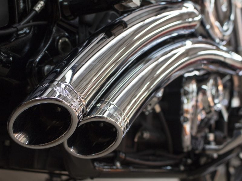 Shiny chrome motorcycle exhaust pipes for enhanced performance and style.