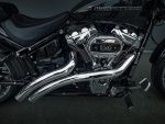 Chrome Harley-Davidson engine and exhaust on a black motorcycle from Revelry Motorcycles, showcasing premium Harley accessories.