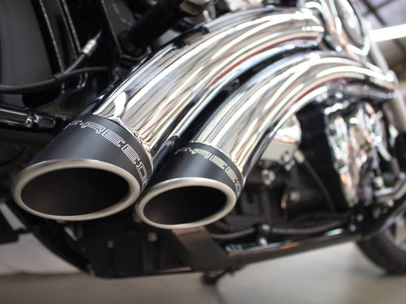 High-performance motorcycle exhaust pipes with chrome finish at Revelry Motorcycles Australia.