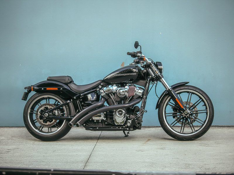 Harley Davidson motorcycle in black with custom wheels for Revelry Motorcycles.