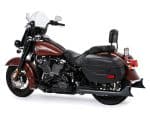 Harley-Davidson touring motorcycle with leather saddlebags and touring windshield for long rides.
