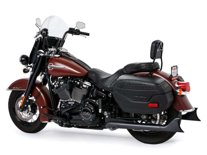 Harley-Davidson touring motorcycle with leather saddlebags and touring windshield for long rides.
