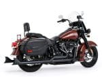 Harley Davidson touring motorcycle with black saddlebags and chrome accents, ideal for long-distance riding.