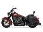 Vibrant brown Harley-Davidson cruiser motorcycle with black accents, ideal for riding adventures.