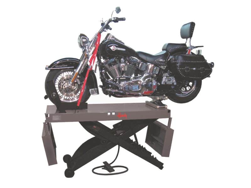 Motorcycle on motorcycle repair lift, Harley Davidson style.