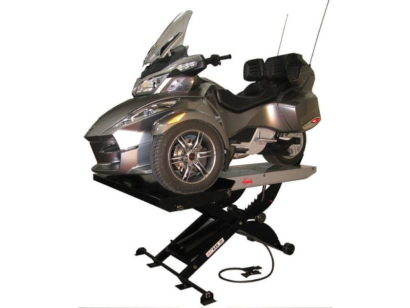 Electric motorcycle on a hydraulic lift for maintenance at Revelry Motorcycles AU.