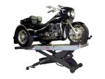 A black Harley-Davidson trike motorcycle on a hydraulic lift for maintenance or display.