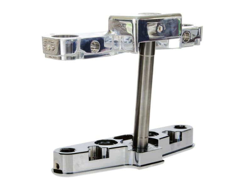 Shiny motorcycle triple tree stem fork clamp for custom bike builds.
