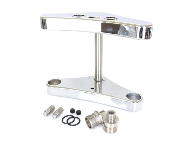 Polished motorcycle triple tree and suspension parts for custom cruiser bikes.