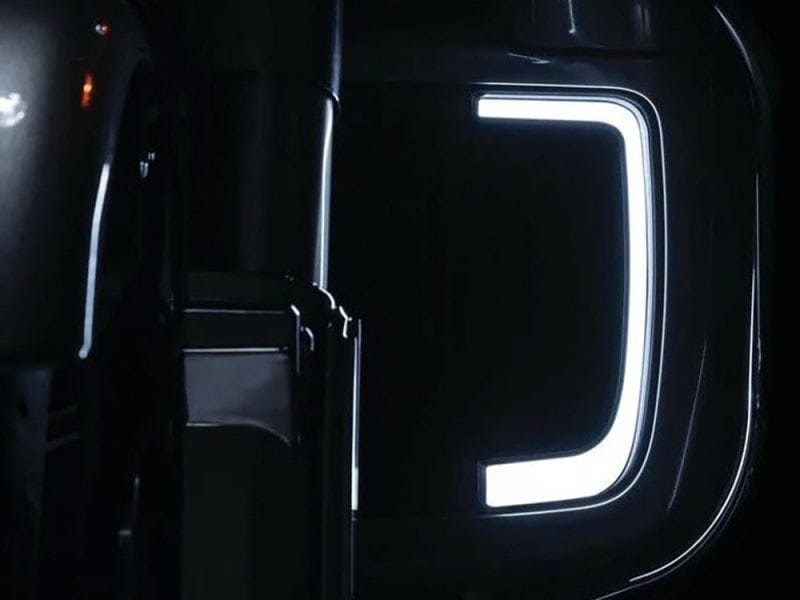 High-tech illuminated motorcycle door with modern LED lighting design.